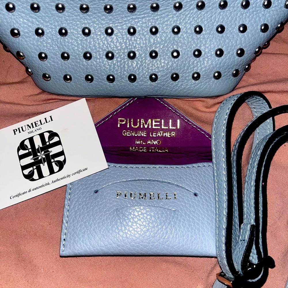 Baby blue authentic Piumelli studded bucket bag